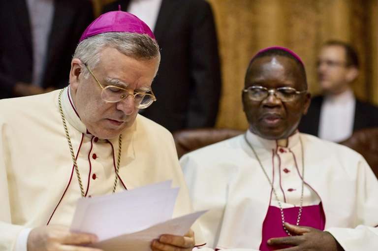 Roman Catholic bishops mediating the talks attend the signing of the accord between the opposition and the government of President Kabila in Kinshasa